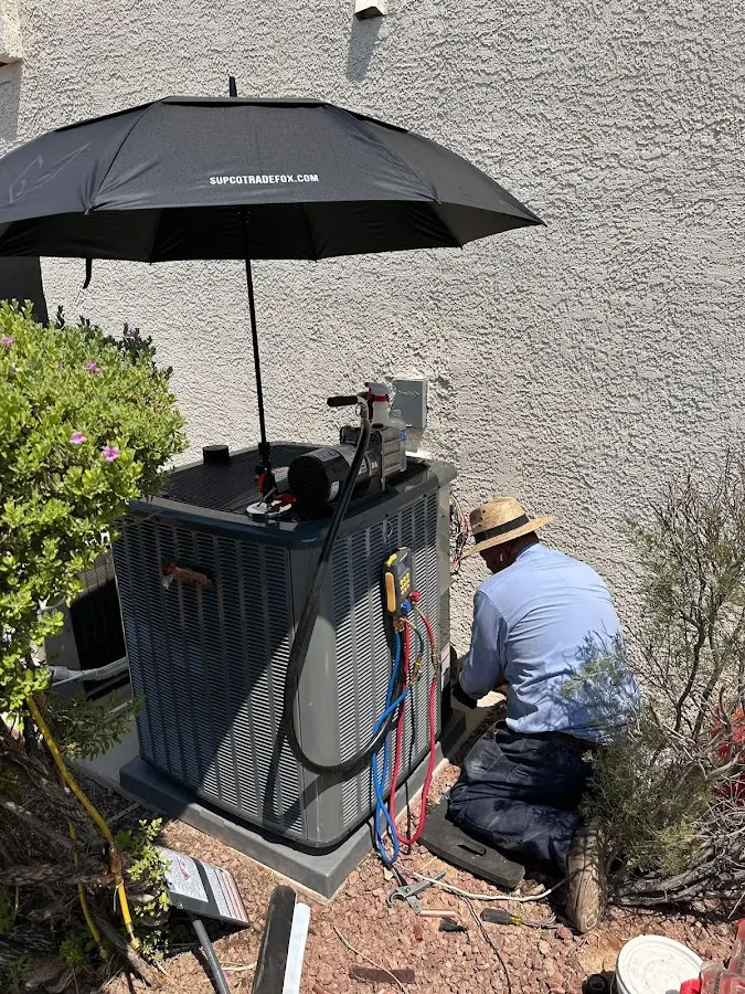 HVAC technician performing outdoor AC maintenance in Lock Haven